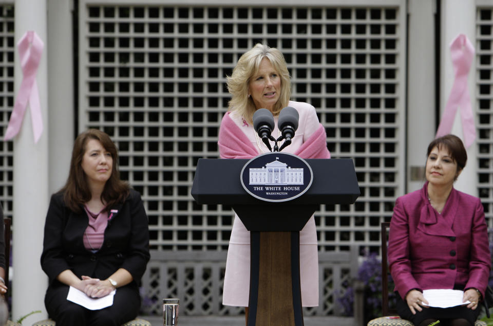 FILE - Jill Biden, center, accompanied by Venus Gines, left, and Joni Lownsdale, speaks during a breast cancer awareness event in the First Lady's Garden at the White House in Washington, Oct. 23, 2009. (AP Photo/Alex Brandon, File)