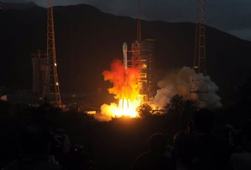 This file photo shows a Long March 3C rocket blasting off from the launch centre in Xichang, China's southwestern province of Sichuan, in 2010. China will next year attempt to land an exploratory craft on the moon for the first time, state media reported, in the latest project in the country's ambitious space programme