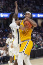 Kent State's VonCameron Davis (1) grabs a rebound as Akron's Ali Ali defends during the first half of an NCAA college basketball game in the championship of the Mid-American Conference tournament, Saturday, March 16, 2024, in Cleveland. (AP Photo/Phil Long)