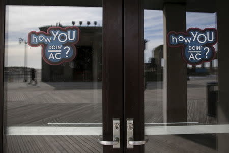 Stickers are seen on the closed doors of a casino in Atlantic City, New Jersey, January 20, 2016. REUTERS/Shannon Stapleton