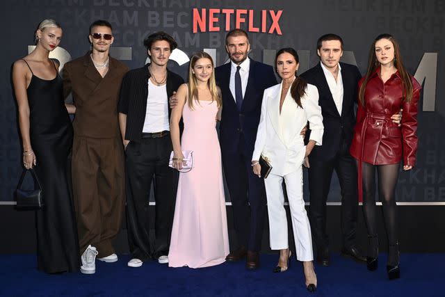 <p>Gareth Cattermole/Getty </p> (From left) Mia Regan, Romeo Beckham, Cruz Beckham, Harper Beckham, David Beckham, Victoria Beckham, Brooklyn Peltz Beckham and Nicola Peltz Beckham.