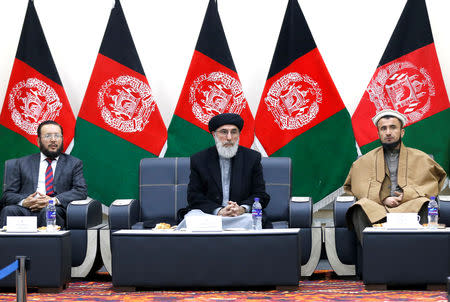 Former Afghan warlord Gulbuddin Hekmatyar (C) alongside his two vice-presidential candidates Fazil Hadi Wazeen and Qazi Hafizulrahman Naqi, arrives to register as a candidate for the presidential election at Afghanistan's Independent Election Commission (IEC) in Kabul, Afghanistan January 19, 2019. REUTERS/Mohammad Ismail