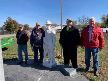 The Marine statue in its new home in Carlisle, Indiana, with veterans Arthur Harris, Larry Cox, George Hale and Rodney Hall.