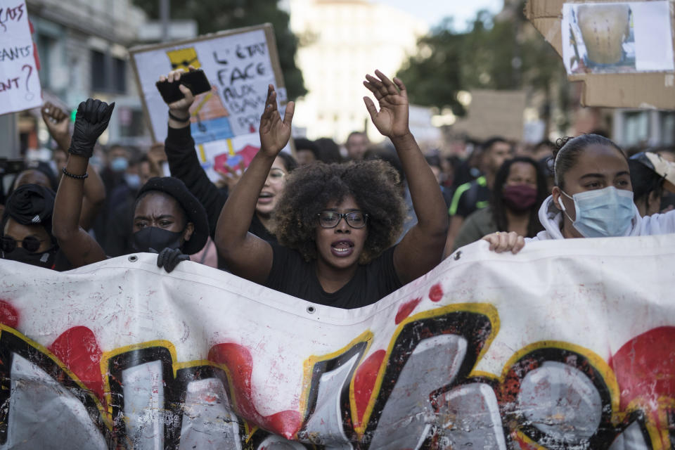 Hawa Traore chants during a march against police brutality and racism in Marseille, France, Saturday, June 13, 2020, organized by supporters of her brother Adama Traore, who died in police custody in 2016. Several demonstrations went ahead Saturday inspired by the Black Lives Matter movement in the U.S. (AP Photo/Daniel Cole)