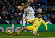 Soccer Football - La Liga Santander - Real Madrid vs Villarreal - Santiago Bernabeu, Madrid, Spain - January 13, 2018 Real Madrid’s Cristiano Ronaldo shoots at goal as Villarreal's Alvaro Gonzalez challenges REUTERS/Javier Barbancho