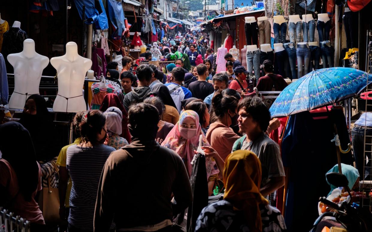 Indonesians fail to adhere to social distancing as they crowd a market in advance of the end of Ramadan - Ed Wray/Getty Images