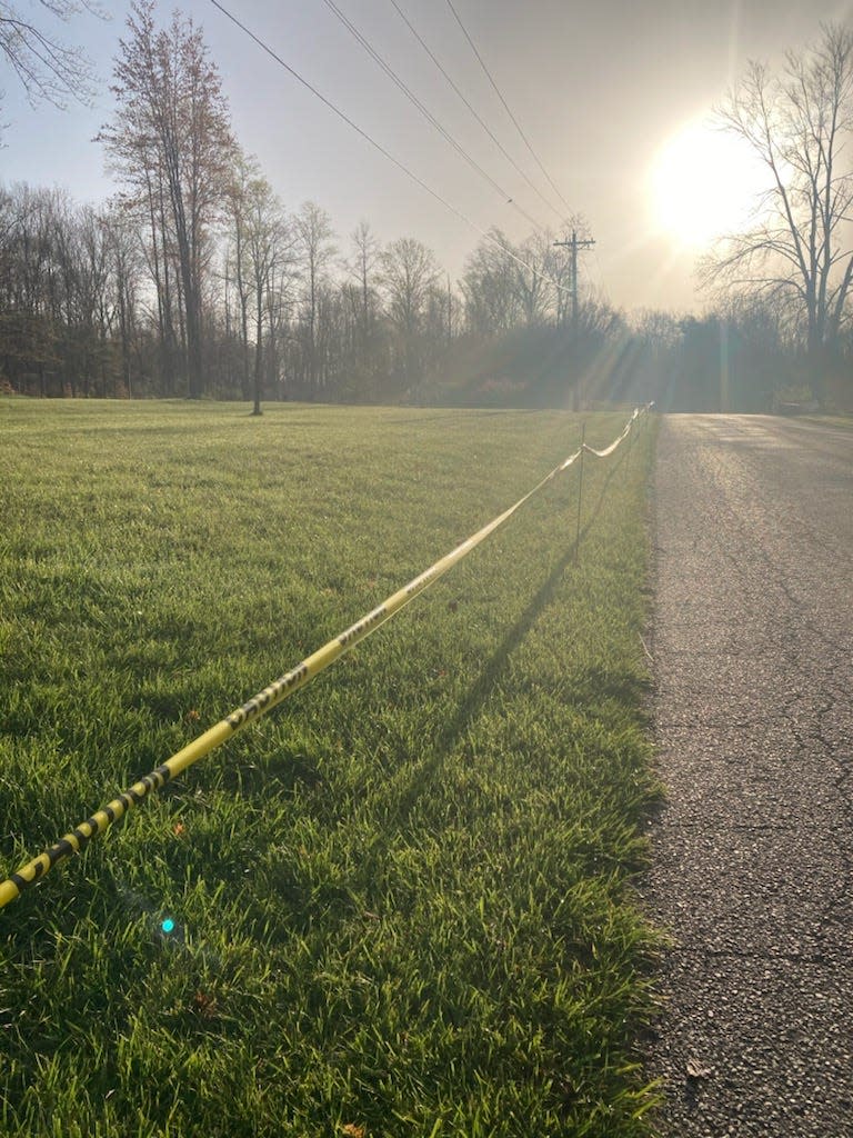 Caution tape is strung across a property on Dittemore Road to prevent eclipse viewers from parking there.