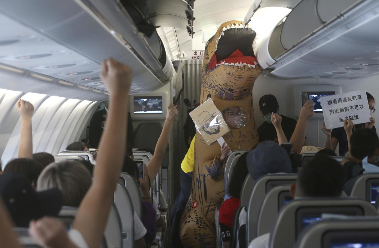 Participants vie to answer a quiz during a fantasy flight in Taipei, Taiwan: AP Photo/Chiang Ying-ying