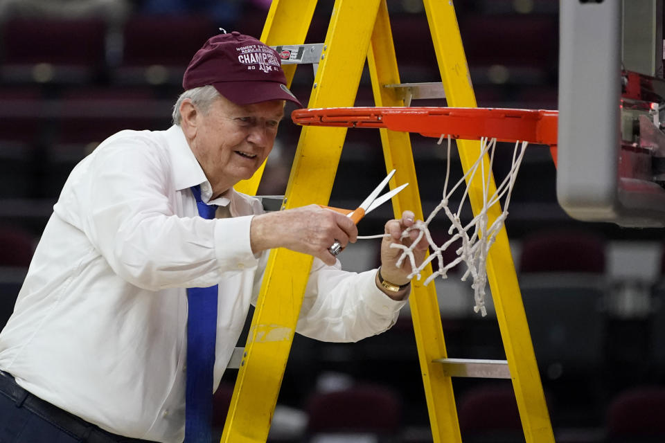 Texas A&M head coach Gary Blair cuts down the net after a win over South Carolina in an NCAA college basketball game Sunday, Feb. 28, 2021, in College Station, Texas. (AP Photo/Sam Craft)