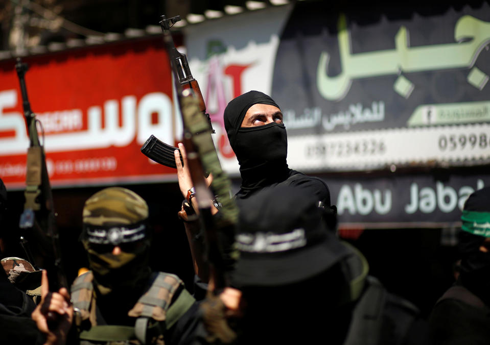 Palestinian members of Hamas’ armed wing take part in the funeral in Gaza City