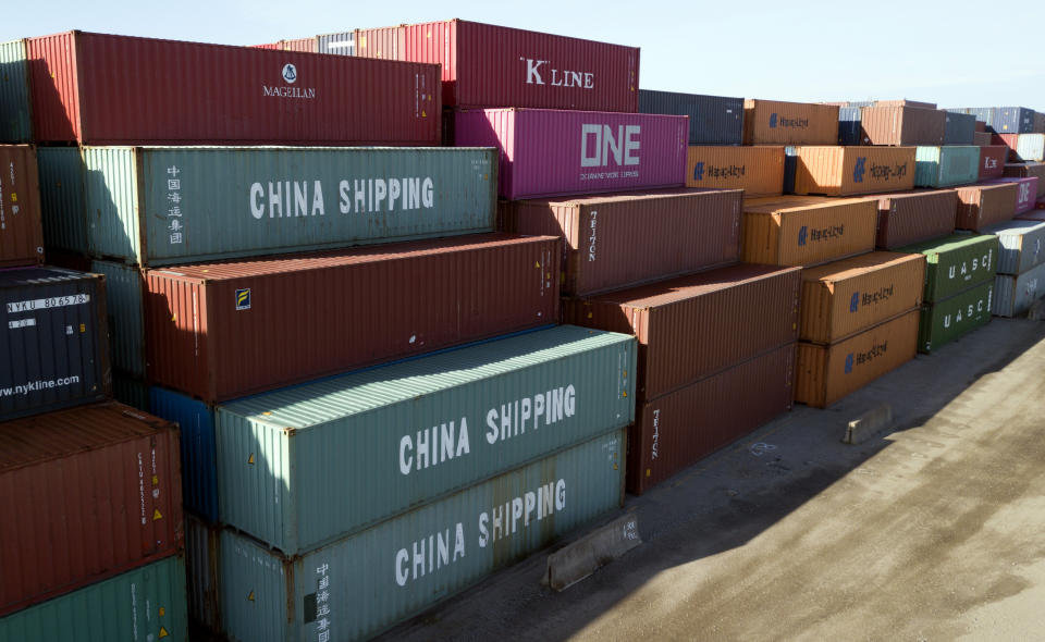 FILE - In this May 10, 2019, file photo China Shipping Company and other containers are stacked at the Virginia International's terminal in Portsmouth, Va. A coalition of 161 manufacturers, farmers, retailers, natural gas and oil companies as well as other business groups, has signed a letter asking President Donald Trump to postpone all tariff rate increases on Chinese goods slated to take effect this year. The letter, dated Wednesday, Aug. 28, and organized by Americans for Free Trade Coalition, comes as tariff increases are set to take effect starting this Sunday, followed by further increases Oct. 1 and Dec. 15. (AP Photo/Steve Helber, File)