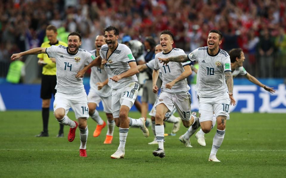 Russia’s players celebrate beating 2010 World Champions Spain on penalties