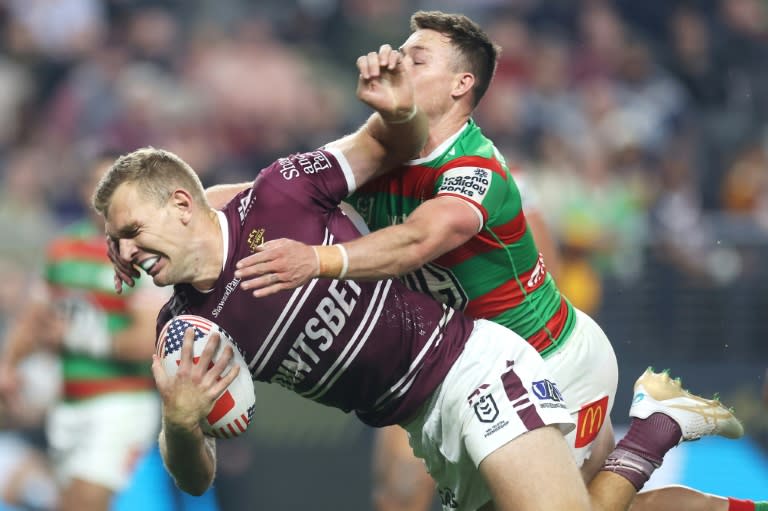 Tom Trbojevic of the Sea Eagles is tackled by Damien Cook of the Rabbitohs (EZRA SHAW)