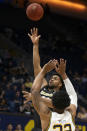 Colorado forward Evan Battey (21) lofts a shot over California forward Andre Kelly (22) during the first half of an NCAA college basketball game Thursday, Feb. 27, 2020, in Berkeley, Calif. (AP Photo/D. Ross Cameron)