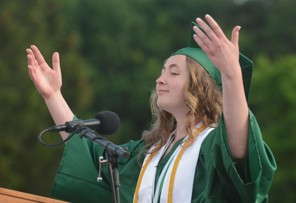 Griswold High School salutatorian Noelle Christie encourages fellow graduates to "take a deep breath" during her address Wednesday at outdoor commencement exercises at the school. There were 120 total graduates.