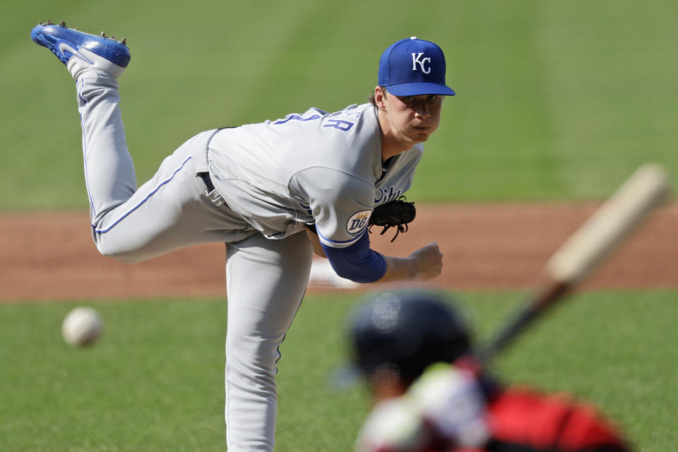 Kansas City Royals starting pitcher Brady Singer delivers to Cleveland Indians' Cesar Hernandez in the first inning in a baseball game Saturday, July 25, 2020, in Cleveland. (AP Photo/Tony Dejak)