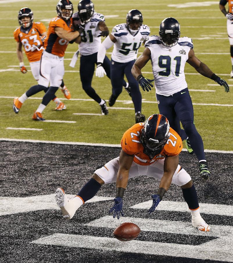 Denver Broncos running back Knowshon Moreno (27) recovers a fumble in the end zone for a safety after a bad snap in the first half of the NFL Super Bowl XLVIII football game against the Seattle Seahawks, Sunday, Feb. 2, 2014, in East Rutherford, N.J. (AP Photo/Kathy Willens)