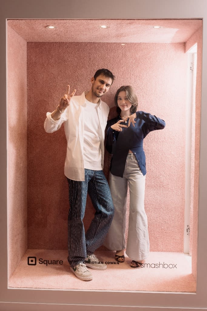 Christian Cowan and Alexa Swinton pose at the opening of his flagship boutique in SoHo, New York City on March 24, 2022. - Credit: Jason Crowley/BFA.com