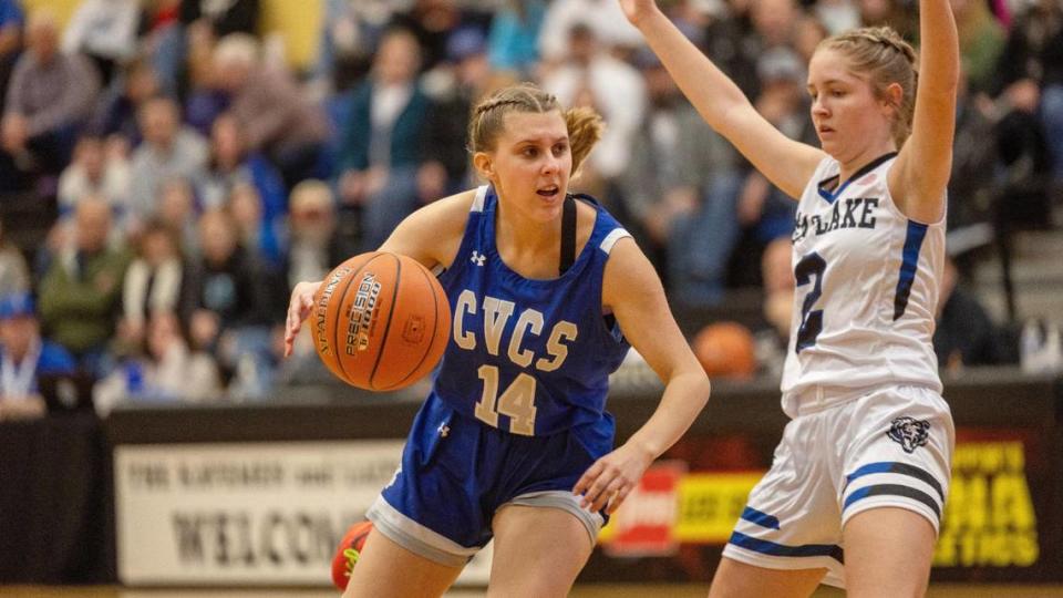 Cole Valley Christian senior Natalie Wetzel dribbles past Bear Lake junior Saydee Shaul in the first half of a 2A state tournament semifinal at Kuna High. 