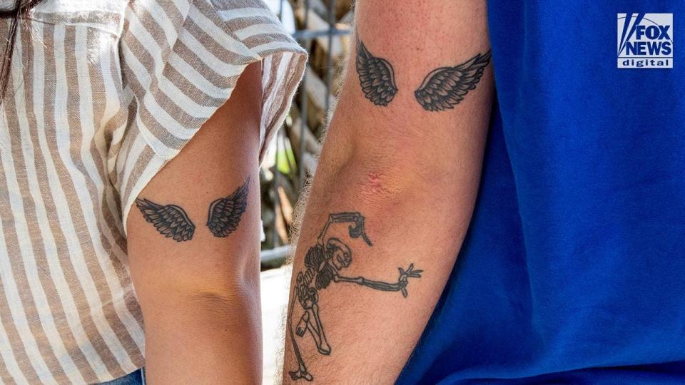 Madison Brooks heroes with matching tattoos of angel wings on their arms