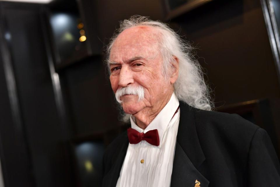 musician david crosby wearing a suit with red bow tie