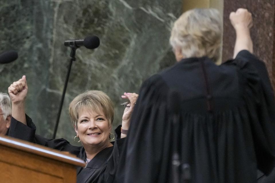 Janet Protasiewicz, left, celebrates with Supreme Court Justice Ann Walsh Bradley before being sworn in as a Wisconsin Supreme Court justice, Tuesday, Aug. 1, 2023, in Madison, Wis. (AP Photo/Morry Gash)