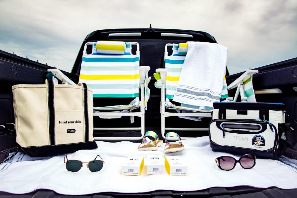 Turo beach bag with beach chairs, sandals and sunglasses