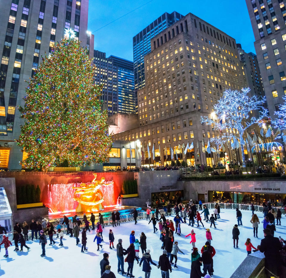 People ice skating under the Christmas tree at Rockefeller Center.