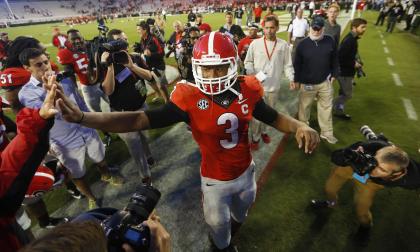 Todd Gurley celebrates with fans after Georgia beat Vanderbilt. (AP)