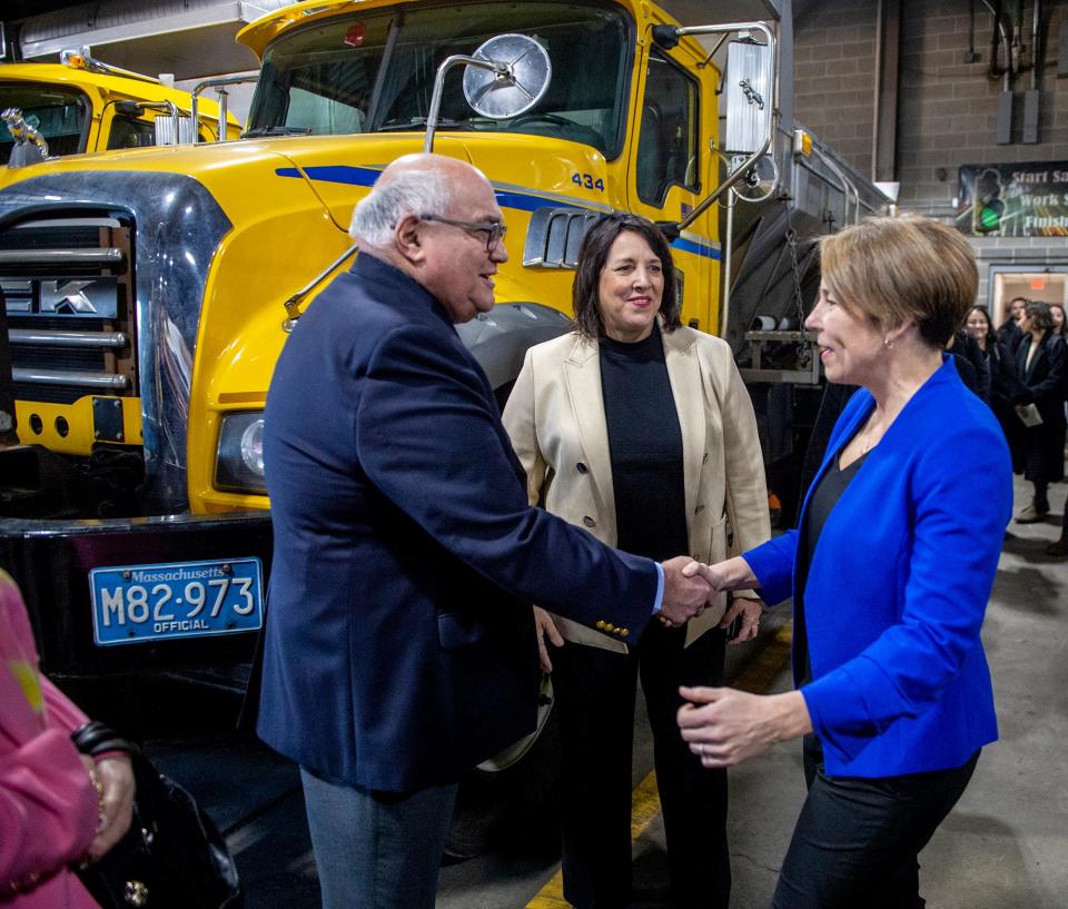 Gov. Maura Healey, right, and Lt. Gov. Kim Driscoll are greeted by Framingham Mayor Charlie Sisitsky before a press conference inside the Framingham DPW facility, Jan. 11, 2023.