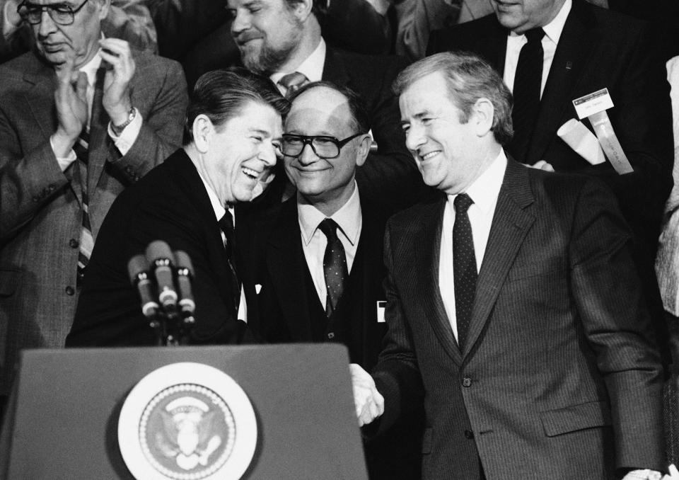 President Ronald Reagan shakes hands with Rev. Jerry Falwell Sr. after a 1984 speech to the convention of National Religious Broadcasters in Washington, D.C.