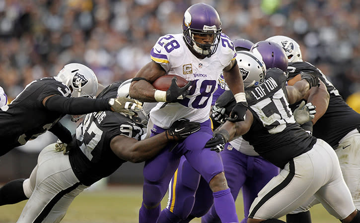 Nov 15, 2015; Oakland, CA, USA; Minnesota Vikings running back Adrian Peterson (28) runs the ball against the Oakland Raiders in the fourth quarter at O.co Coliseum. The Vikings defeated the Raiders 30-14. Mandatory Credit: Cary Edmondson-USA TODAY Sports