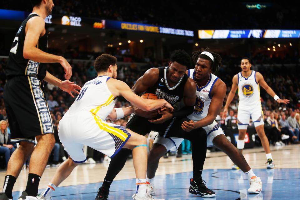 Memphis Grizzlies forward Jaren Jackson Jr. (13) secures a rebound the Golden State Warriors guard Klay Thompson (11) on March 9, 2023 at the Fedex Forum in Memphis.