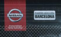 FILE PHOTO: The logo of Nissan is seen through a fence at Nissan factory at Zona Franca during the coronavirus disease (COVID-19) outbreak in Barcelona