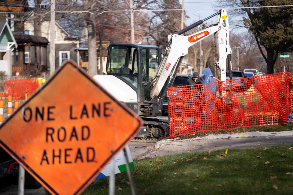 Workers from Torgerson Excavating work Dec. 6 to replace lead water service lines in Des Moines' River Bend neighborhood.
