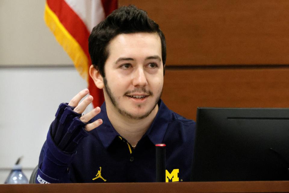 Former Marjory Stoneman Douglas High School student Benjamin Wikander shows the brace he wears on his hand after he was shot (REUTERS)