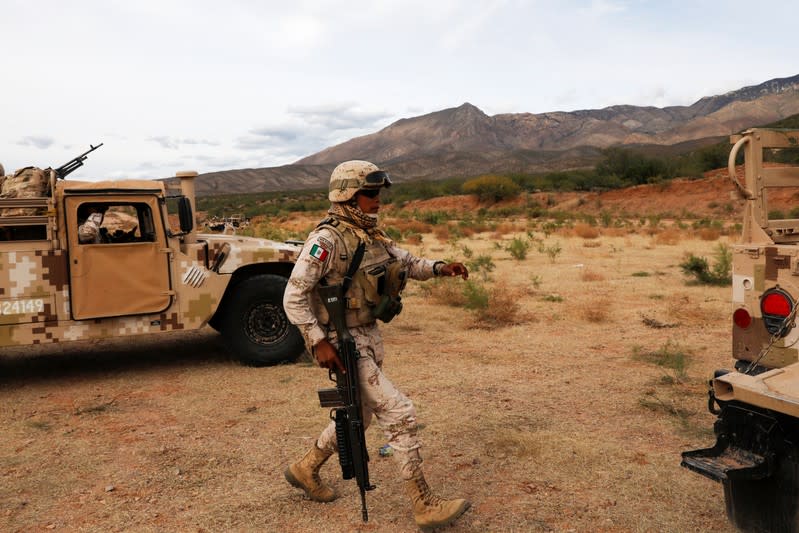 Soldiers are seen outside the Mormon community La Mora, Sonora