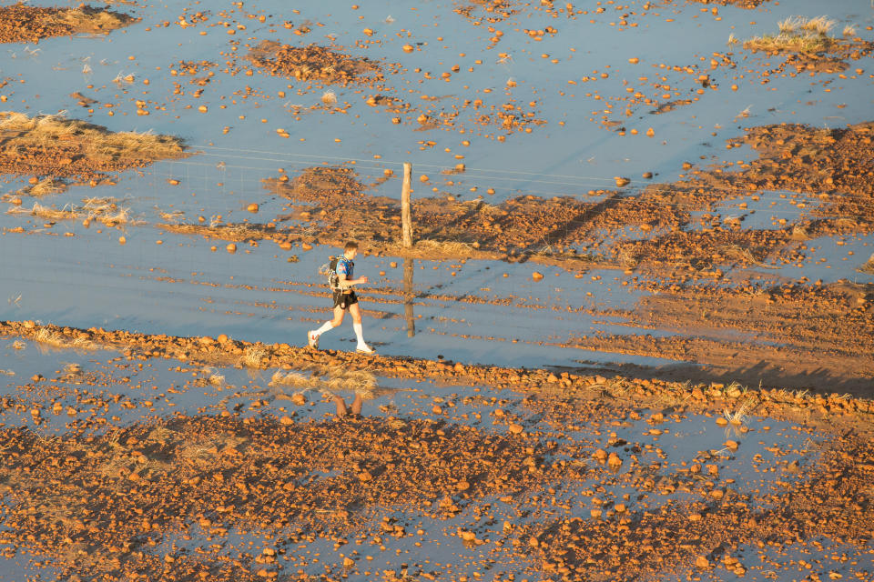 Aerial image of Kay Bretz running