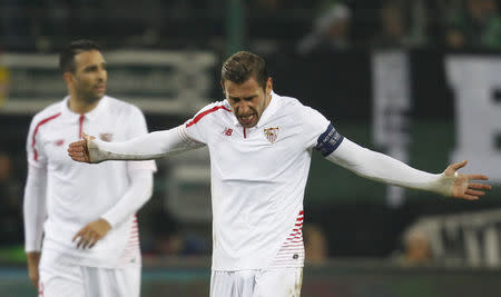 Football Soccer - Borussia Moenchengladbach v Sevilla - UEFA Champions League Group Stage - Group D - Borussia-Park, Moenchengladbach, Germany - 25/11/15 Sevilla's Adil Rami and Grzegorz Krychowiak react REUTERS/Ina Fassbender