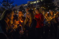 <p>People light candles as they gather to remember the victims of the recent truck attack during a candle light walk along the Hudson River near the crime scene on Thursday, Nov. 2, 2017, in New York. (Photo: Andres Kudacki/AP) </p>