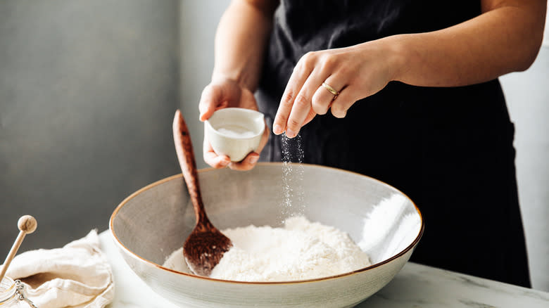 Sprinkling salt into bowl