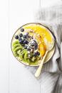 <p>Got an extra minute in the morning? Use it to deck out this gorgeous, fruit-filled smoothie bowl with fresh sliced fruit and shredded coconut. </p><p>Get the <strong><a href="https://www.goodhousekeeping.com/food-recipes/a38877/tropical-smoothie-bowl-recipe/" rel="nofollow noopener" target="_blank" data-ylk="slk:Tropical Smoothie Bowl recipe;elm:context_link;itc:0" class="link ">Tropical Smoothie Bowl recipe</a></strong>.<strong><br></strong></p>