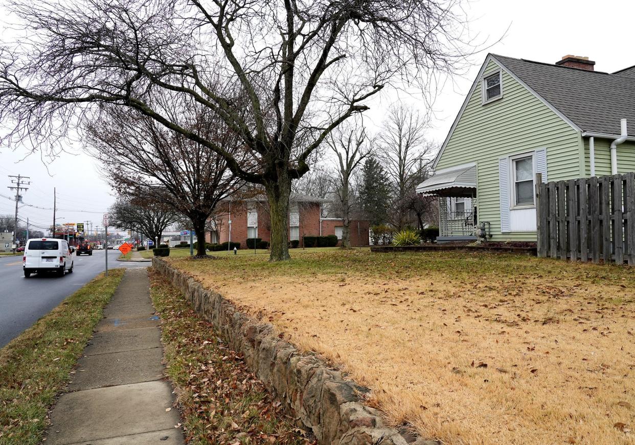 December 6, 2022; Columbus, Ohio; The Community Builders wants to build a three-story, 27-unit affordable housing apartment building where O.R. Woodyard Funeral Home, 2300 E. Livingston Ave., is located. Neighbors objected to the zoning decision. The funeral home is seen at center behind trees along Livingston Ave. Fred Squillante-The Columbus Dispatch