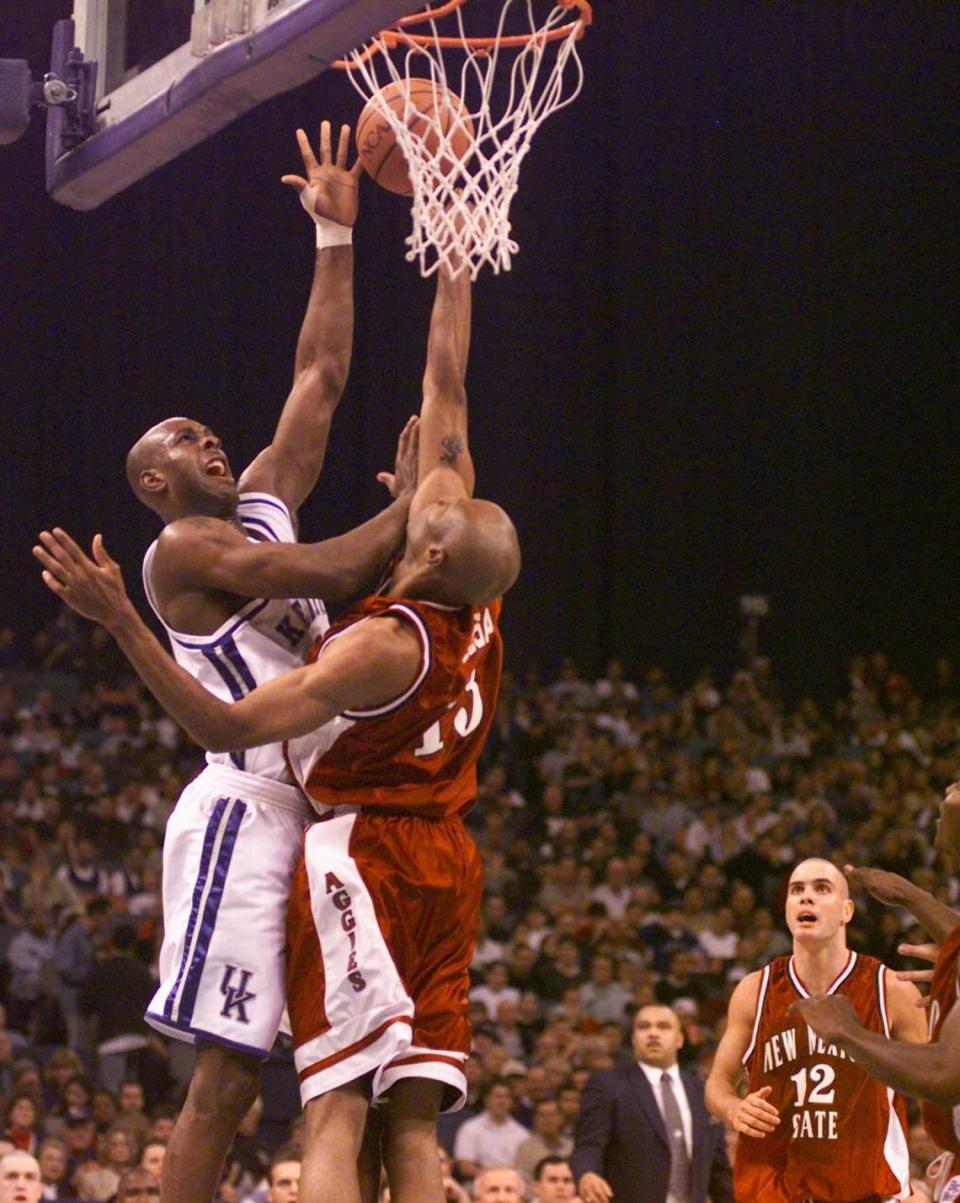 Kentucky forward Heshimu Evans scored two of his team-high 15 points over New Mexico State’s Charles Gosa during the Wildcats’ 82-60 victory over the Aggies in the 1999 NCAA Tournament round of 64.