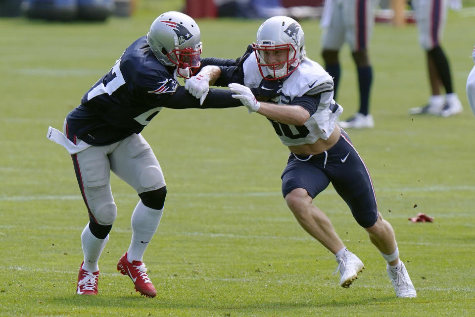 New England Patriots defensive back J.C. Jackson (27) and wide receiver Gunner Olszewski (80) run a passing drill during an NFL football training camp practice, Monday, Aug. 24, 2020, in Foxborough, Mass. (AP Photo/Steven Senne, Pool)