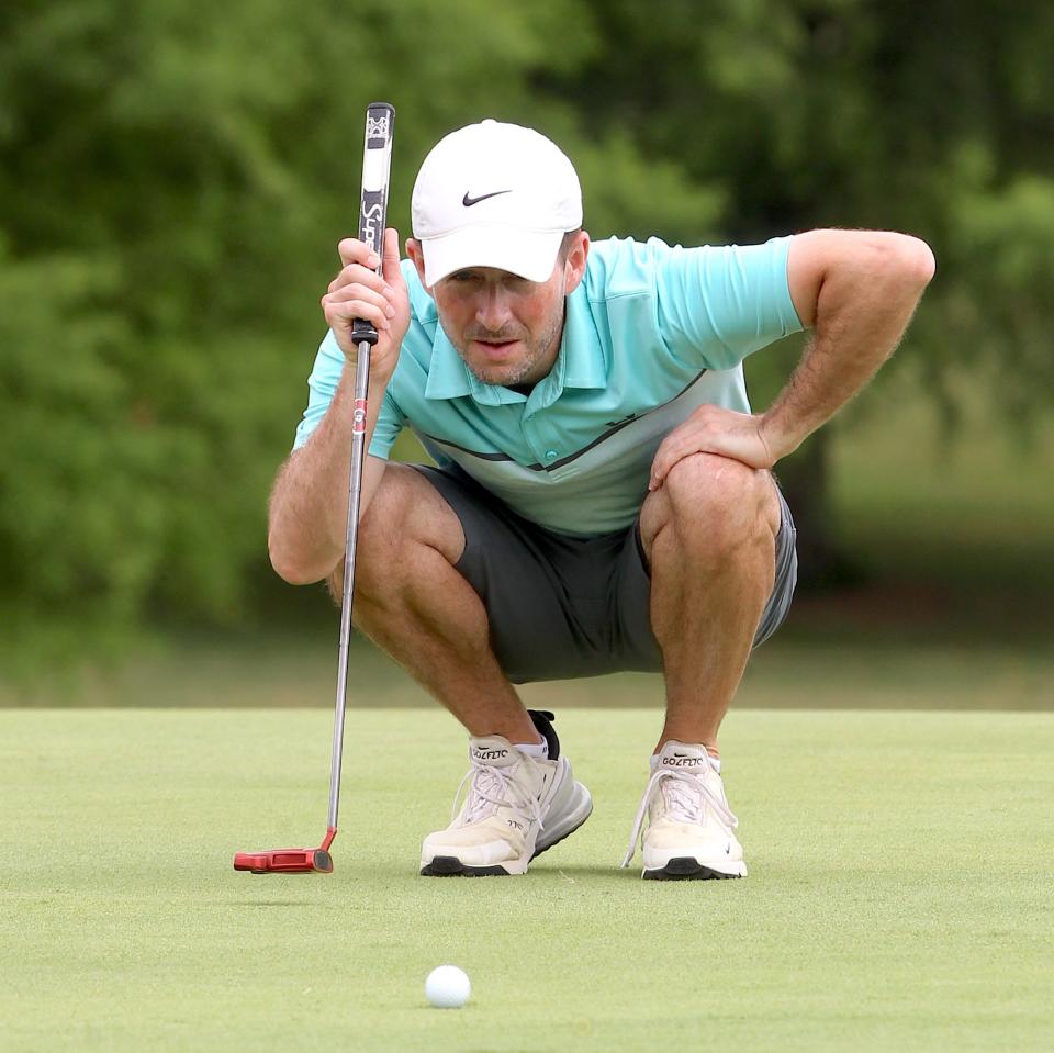 Doak Henry eyes a putt to begin his final round of the City Qualifying Tournament at Cascades Golf Course on Sunday, June 26, 2022. Henry fired a 70 to win the Men's portion by one shot over Logan Vernon with a birdie on 18.