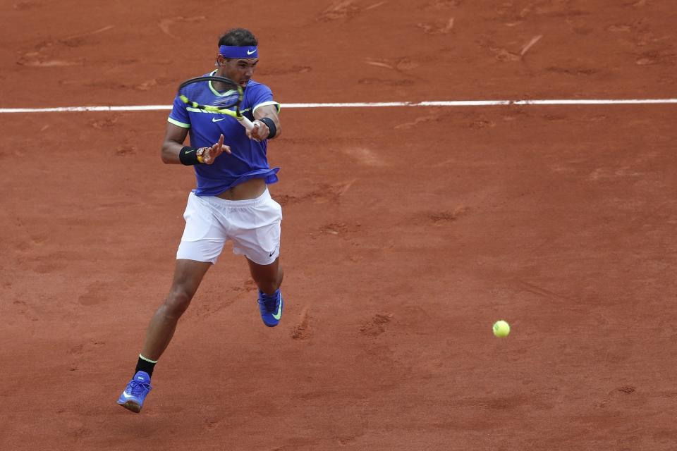 Rafael Nadal returns the ball to Georgia's Nikoloz Basilashvili during their third round match of the French Open