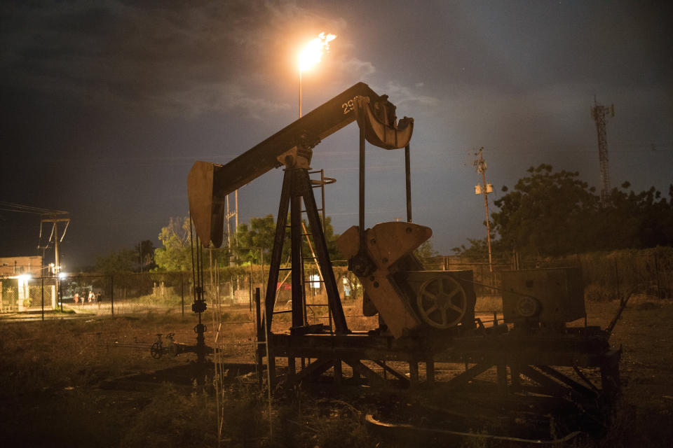 A non-operational oil pump, owned by state-owned oil company PDVSA, stands still in Cabimas, Venezuela, May 16, 2019. Venezuela's oil boom through the 1990s has since turned to bust, as its production has crashed to one-fifth of its all-time high two decades ago. (AP Photo/Rodrigo Abd)