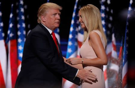 Republican U.S. presidential nominee Donald Trump greets his daughter Ivanka as he arrives to speak during the final session at the Republican National Convention in Cleveland, Ohio, U.S. July 21, 2016. REUTERS/Brian Snyder
