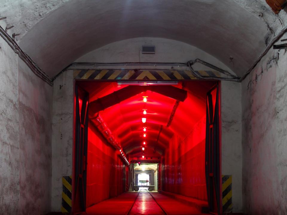 dark hallway inside balaklava naval base with red lights overhead